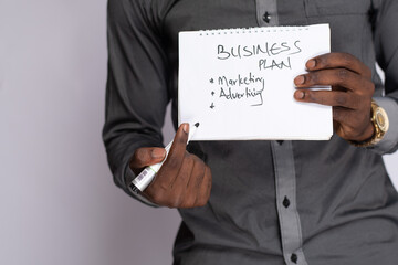 Wall Mural - african businessman holding a business plan