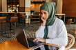 © JLCo Ana Suanes - Muslim student studying in a cafe