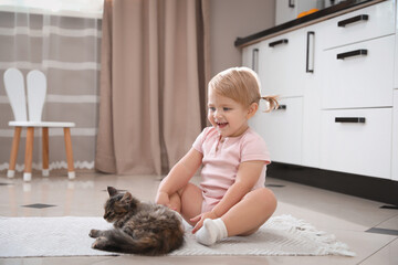 Sticker - Cute little child with adorable pet on floor at home