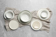© New Africa - Set of clean tableware on grey table, flat lay