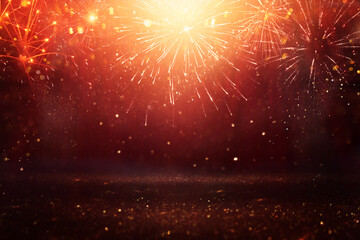 abstract black and gold glitter background with fireworks. christmas eve, 4th of july holiday concept