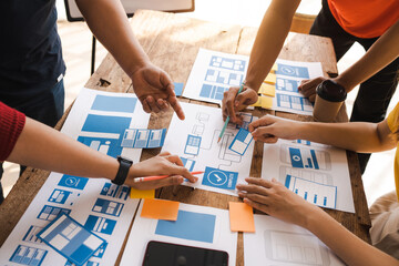 working at desk, start up, ux team works from a single location under a ux leader and ux managers, u