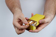 © Max - One hand takes out a cigarette from a pack held by the other
