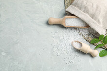 Wooden Scoops With Natural Sea Salt And Sack On Light Grey Marble Table. Space For Text