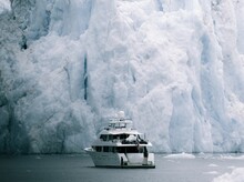 Luxury Yacht Next To Glacier In Alaska