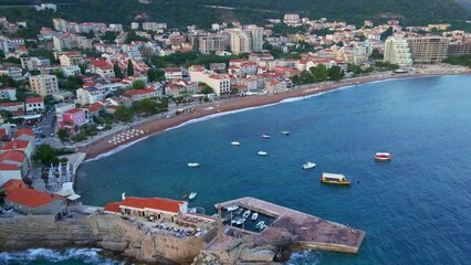 Wall Mural - Aerial video. The city of Petrovac a coastal city on Adriatic sea. Travel to Montenegro concept