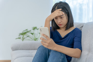 Wall Mural - Unhappy asian woman girl disappointed, sad about problem in home alone, feel lonely, Stressed, suffering from bad relationship, break up, divorce, female confused, depression mental health, loneliness