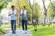 happy couple asian elder jogging running  with smile in park