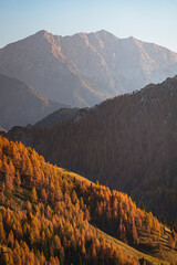 Wall Mural - The mountains of Val Brembana, near the town of San Simone (Italy) with the colors of the golden hour - October 2022.