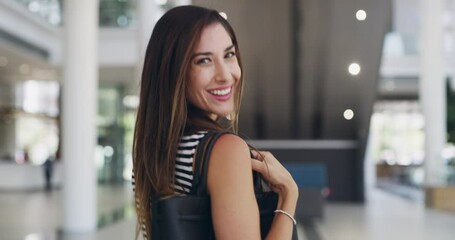 Poster - Business woman, walking and looking back in modern office lobby. Businessperson, confidence and happy female employee from Canada ready for start of day arriving at company workplace in the morning.