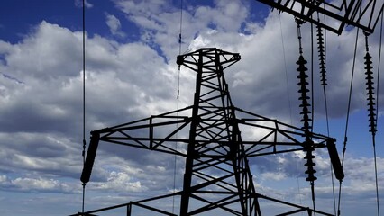 Wall Mural - Electricity pylon (high voltage power line), black contour, on the background of the cloudy sky (time lapse) 