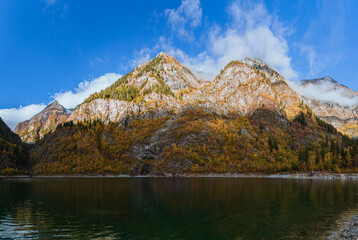 Wall Mural - Autumn colors during the early morning, between the mountains and woods of the Antrona valley, near the town of Antronapiana, Italy - October 2022.