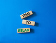 © Natallia - Time to relax symbol. Concept word Time to relax on wooden blocks. Beautiful blue background. Business and Time to relax concept. Copy space