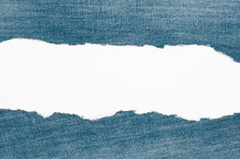 Torn edge grunge denim material   on a white  background