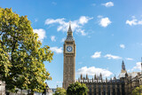 Fototapeta Londyn - The famous Big Ben clock tower against a blue sky in London, England