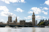 Fototapeta Londyn - The famous Big Ben and the English Parliament along the river Thames in London, England