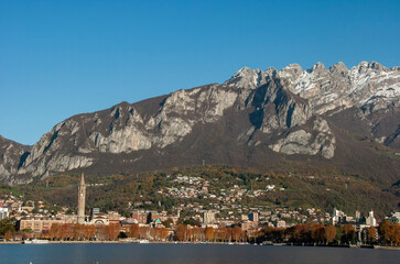 Wall Mural - Landscape of Lecco town in an autumnal evening