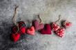 © RooM The Agency - Overhead view of handmade textile rustic heart ornaments on a table