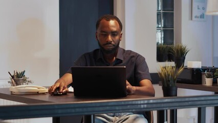 Executive manager working late at night to create presentation, analyzing research and online data in office. Brainstorming ideas to plan report and software developer application.