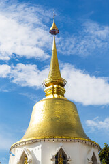 Thai style golden pagoda over blue sky, Thai historical and religious architecture