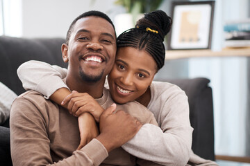 Wall Mural - Love, hug and portrait of a happy couple on sofa in the living room of their modern home. Happiness, smile and black woman relax with husband, care and marriage on couch at the house lounge together