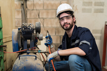Aufkleber - Factory male engineer worker working with air compressor in the industry factory. Male engineer worker checking or maintenance air compressor machine in the workshop