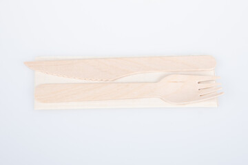 Canvas Print - recyclable wooden fork and knife made from recycled paper and wood on white Background