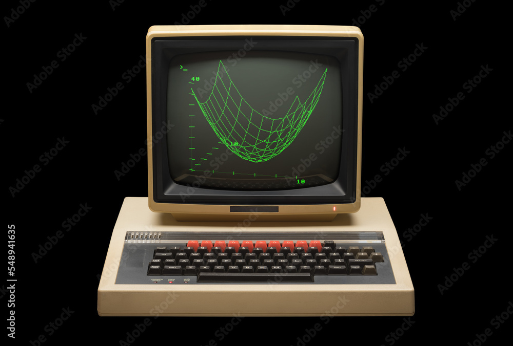 1980s personal computer with monitor frontal view against a black ...