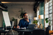© bnenin - Thougtful businessman looking on the side, working over the laptop.