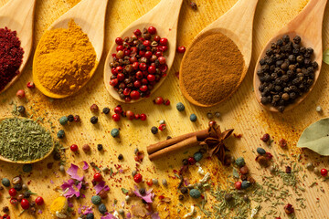 Wall Mural - various spices in wooden spoons