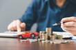 © JD8 - Concept of car insurance business, saving buy - sale with tax and loan for new car. Car toy vehicle with stack coin money on background. Planning to manage transportation finance costs. loan for car
