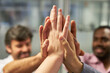 © Robert Kneschke - Hands of business people high five for team spirit