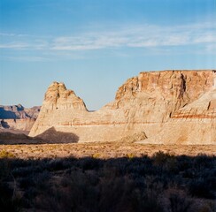 Canvas Print - Beautiful shot of rocky canyons in the desert under blue cloudy sky