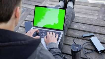 Male Working Outdoor with Laptop Computer