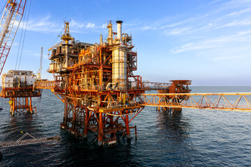 Silhouette, Offshore Jack Up Rig in The Middle of The Sea at Sunset Time