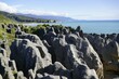 Pancake rocks with a side a ocean in New Zealand south island.