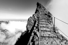 “Ninho Da Manta“ A Panoramic View Point Near “Pico Do Arieiro“ Peak, Madeira Island Portugal. Narrow Mountain Ridge With Steep Precipice Both Sides The Trail. Black And White Scenic Panorama.