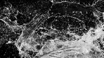 Fototapete - Super slow motion of water splashes in collision, isolated on black background. Filmed on high speed cinema camera, 1000fps. Speed ramp effect.