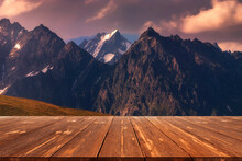 Late Autumn View Of Caucasus Mountains With Empty Wooden Table. Natural Template Landscape