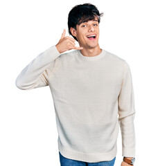 Sticker - Handsome hipster young man wearing casual winter sweater smiling doing phone gesture with hand and fingers like talking on the telephone. communicating concepts.