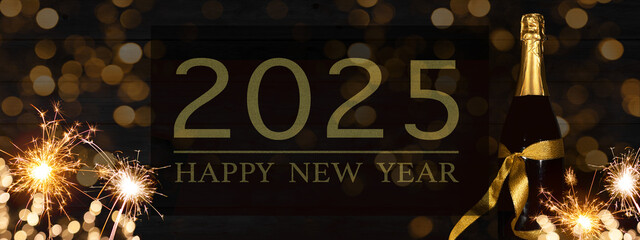Aufkleber - HAPPY NEW YEAR 2025 celebration background banner panorama long- Sparklers and champagne or sparkling wine bottle on rustic black wooden wall texture.
