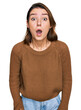 © Krakenimages.com - Young caucasian girl wearing casual clothes scared and amazed with open mouth for surprise, disbelief face