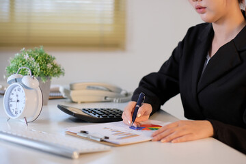 Poster - Finance and accounting concept, female accountant using calculator and computer in office