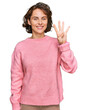 © Krakenimages.com - Young hispanic woman wearing casual clothes showing and pointing up with fingers number four while smiling confident and happy.