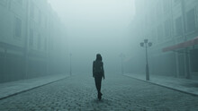 Silhouette Of A Woman Walking Alone In The Fog On Lonely Moody Cobblestone Street