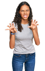 Canvas Print - Young african american girl wearing casual clothes smiling funny doing claw gesture as cat, aggressive and sexy expression