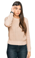 Poster - Young brunette woman wearing casual winter sweater worried and stressed about a problem with hand on forehead, nervous and anxious for crisis