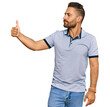 © Krakenimages.com - Handsome man with beard wearing casual clothes looking proud, smiling doing thumbs up gesture to the side