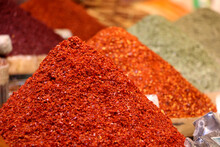 Spice Varieties Sold In The Form Of Pyramids In The Spice Market. Red Chili Pepper Varieties
