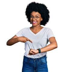 Wall Mural - Young african american woman wearing casual white t shirt in hurry pointing to watch time, impatience, upset and angry for deadline delay